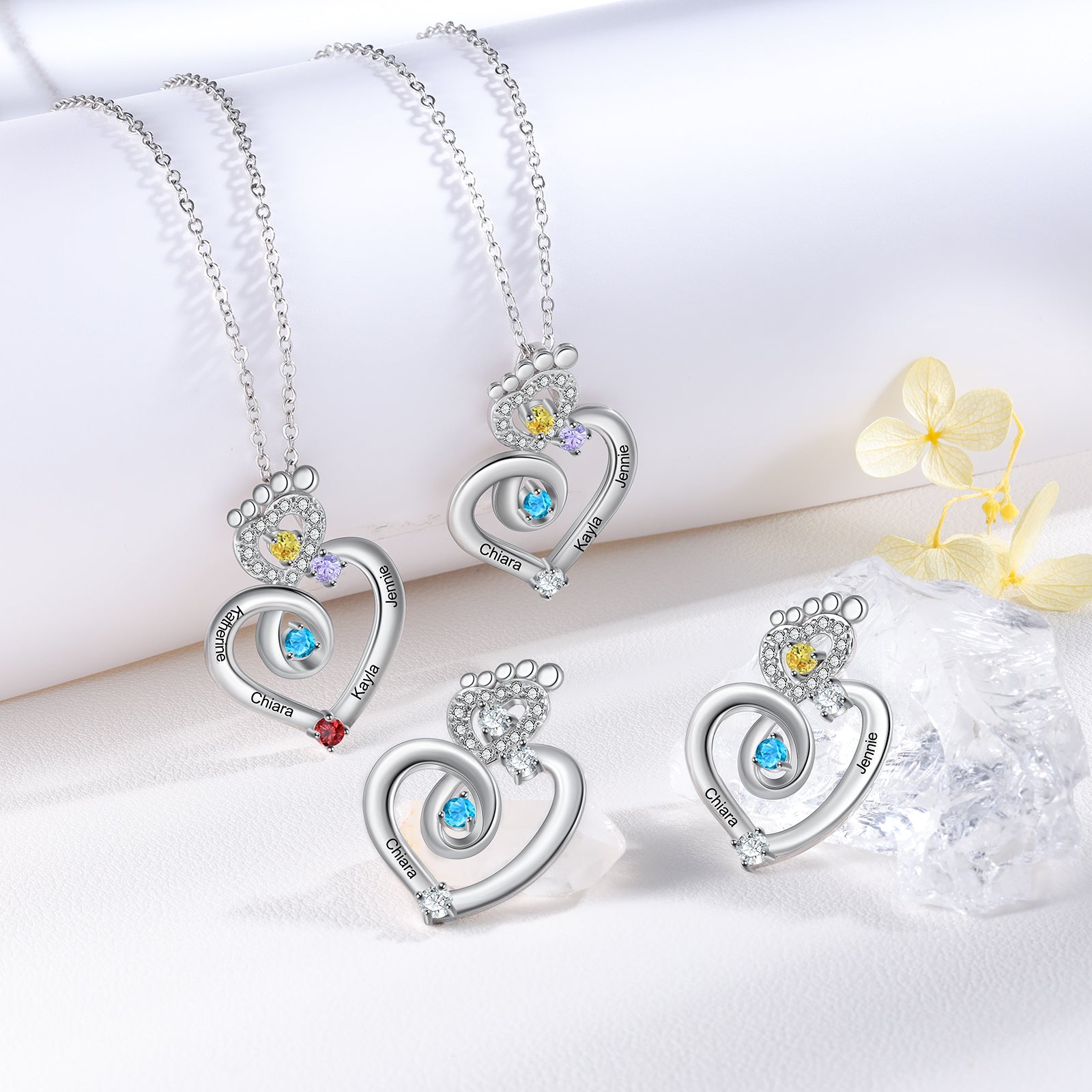 name ring, Silver heart necklace collection with colorful gemstones on a white background