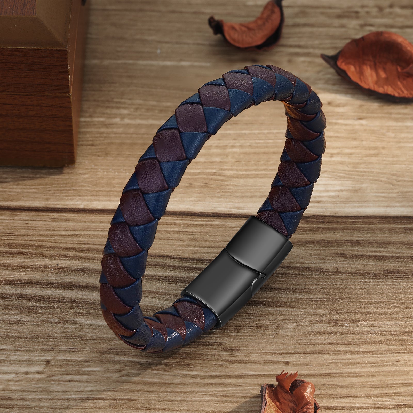 earrings with names, Personalized men's leather bracelet on wooden surface with dried leaves