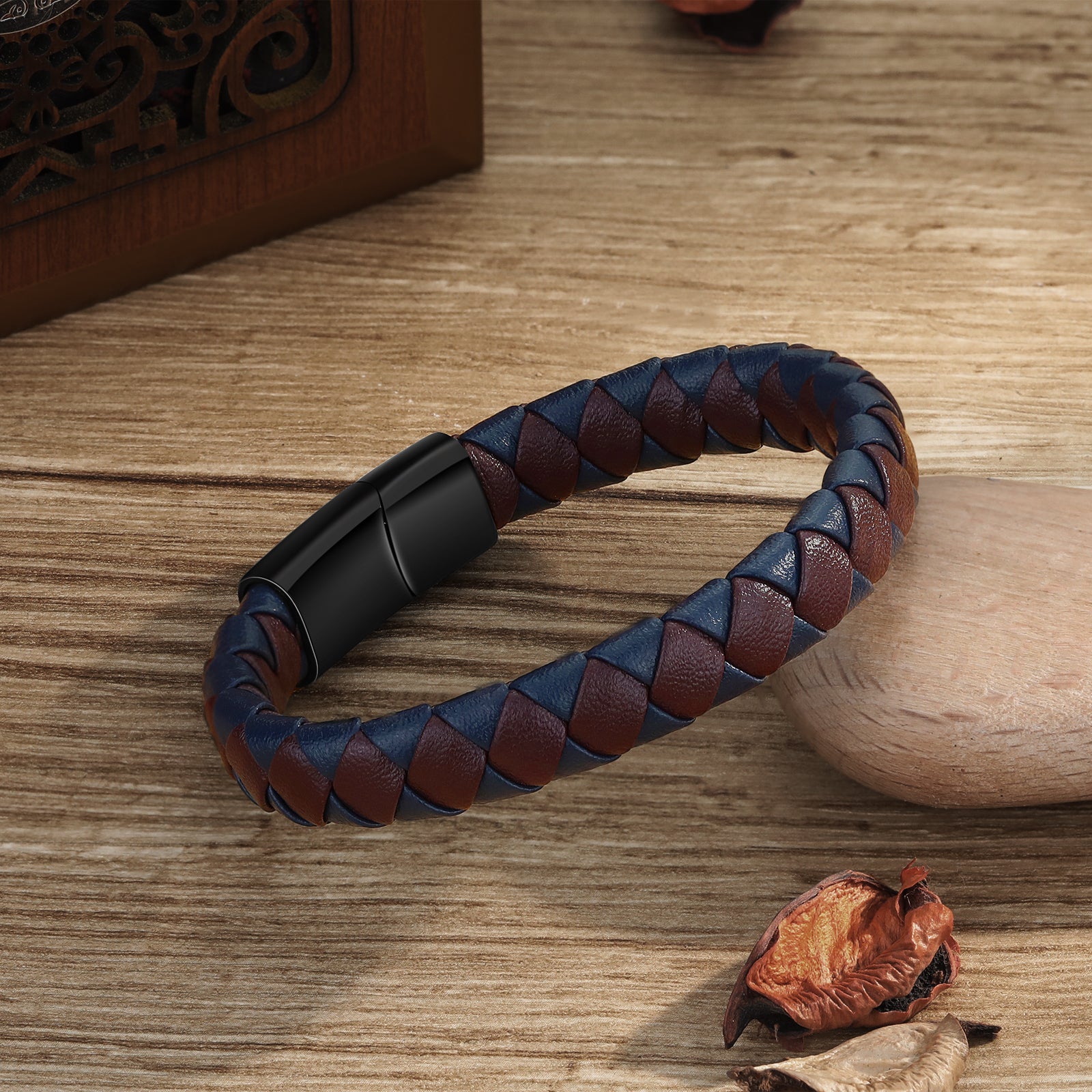 name keychain, Personalized men's bracelet with blue and brown leather braid on wooden surface