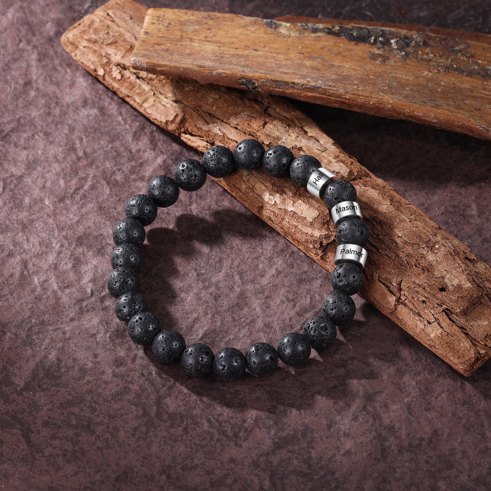stone bead necklace, Personalized bracelet with black beads and silver charms on a wooden surface