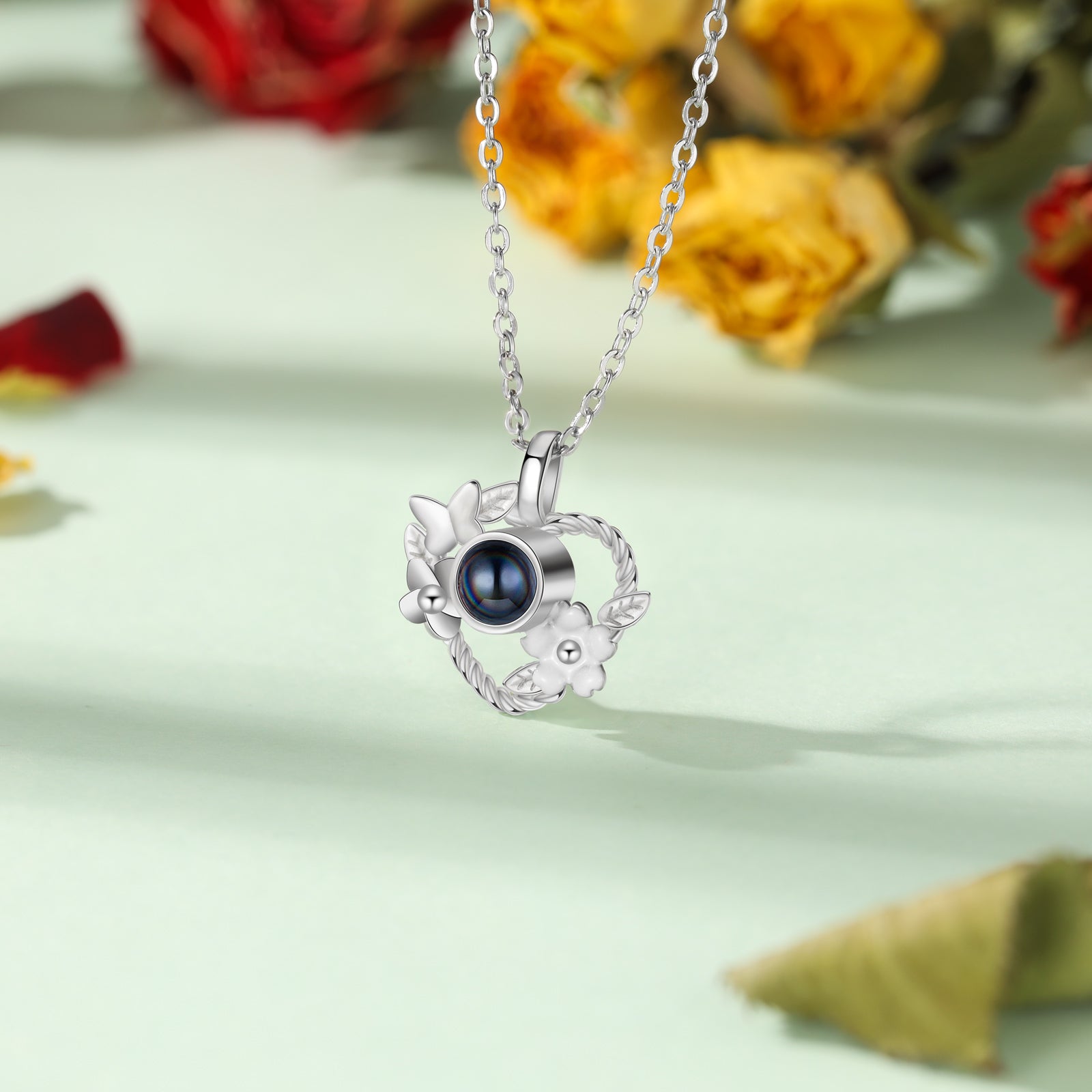 ring sound, Photo Necklace with heart-shaped pendant and blue gemstone on silver chain