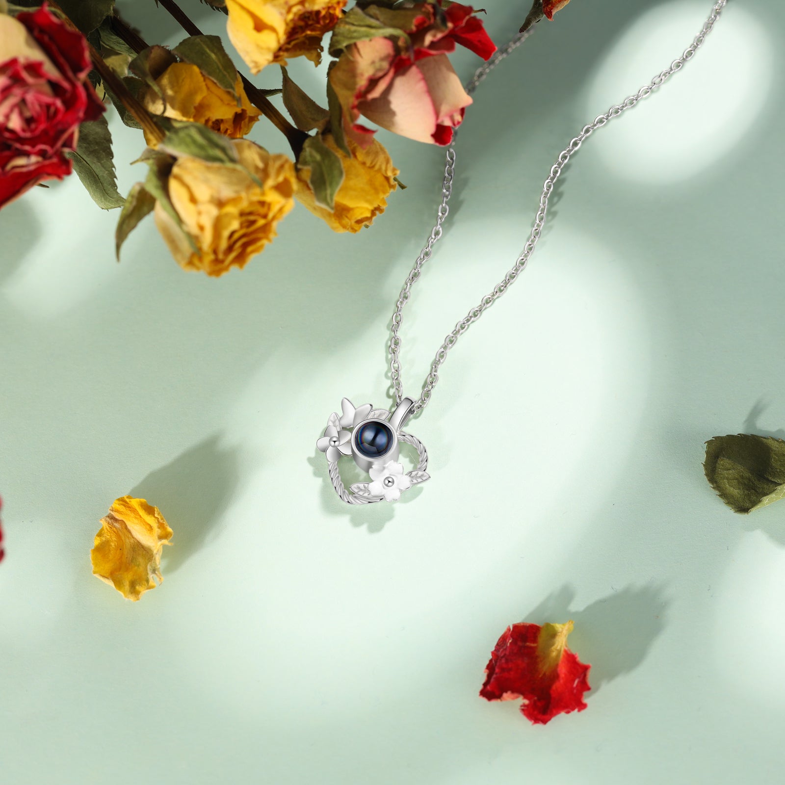 name earrings, Silver pendant necklace with black pearl and floral motif on green, with dried roses.
