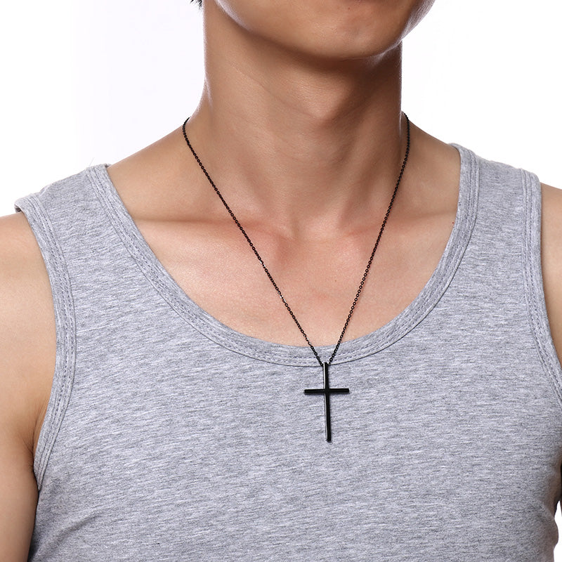 Custom Cross Necklace on black chain worn with gray tank top against white background