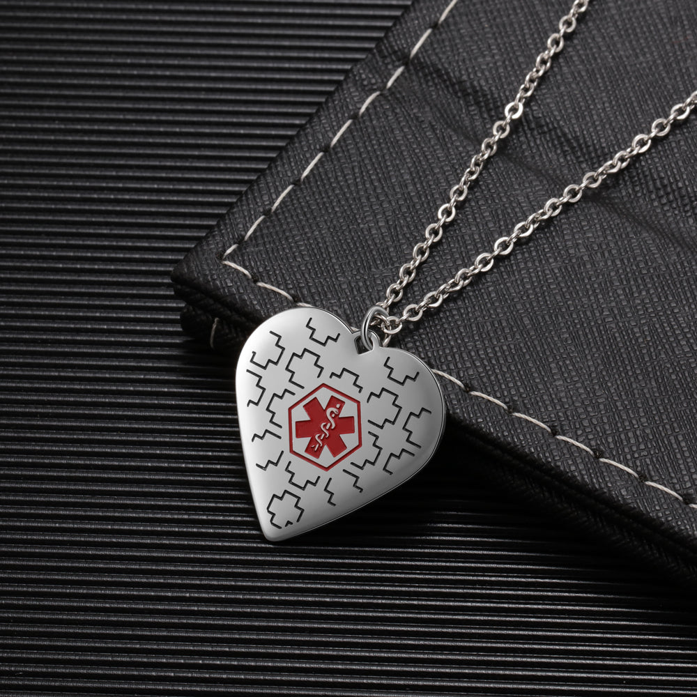 photo ring, silver heart-shaped medical alert necklace with red cross on black wallet