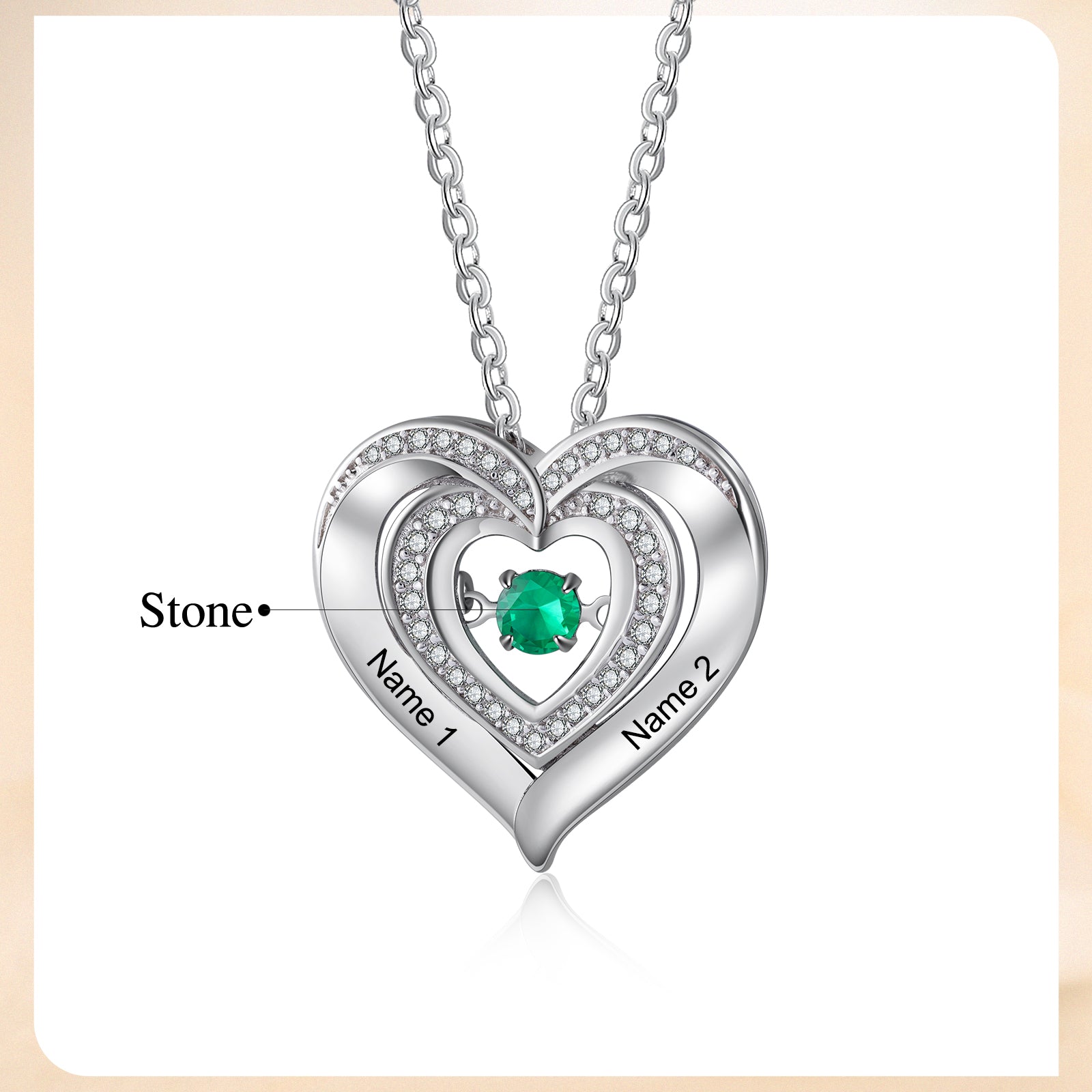 Silver heart photo necklace with green gemstone, featuring personalized design.