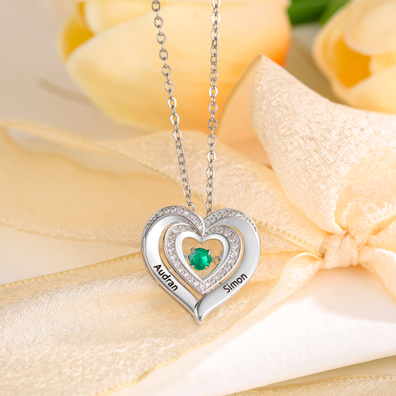 personalized heart necklace with names Audran and Simon, green gemstone, picture necklace