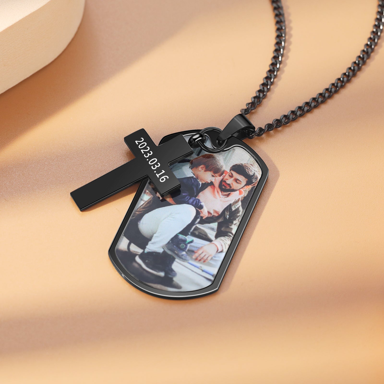 ring sound, Black photo necklace with a personal image on dog tag, features a black cross.