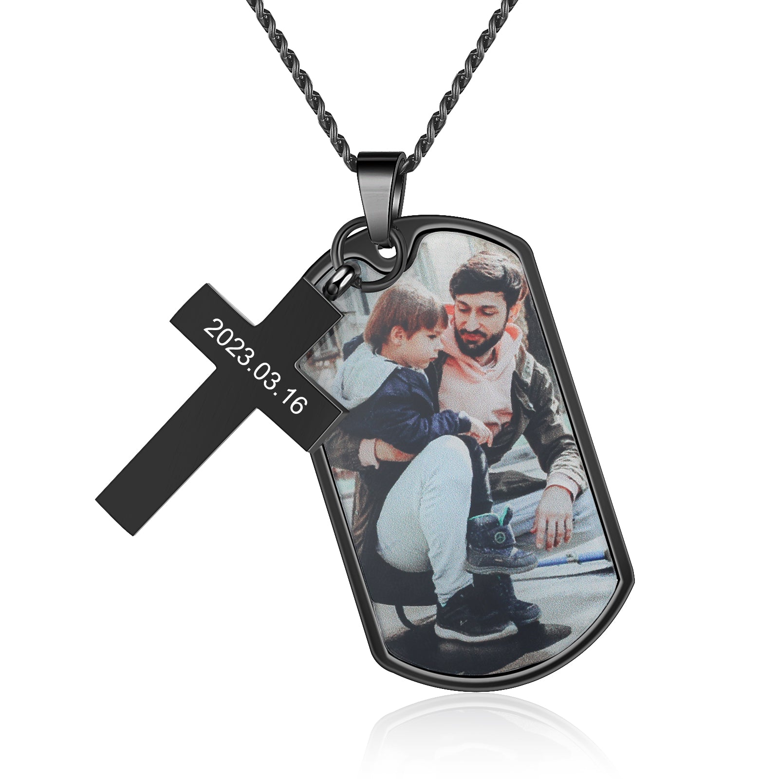 ring, Black dog tag with photo necklace of man in black jacket, child in blue jacket.