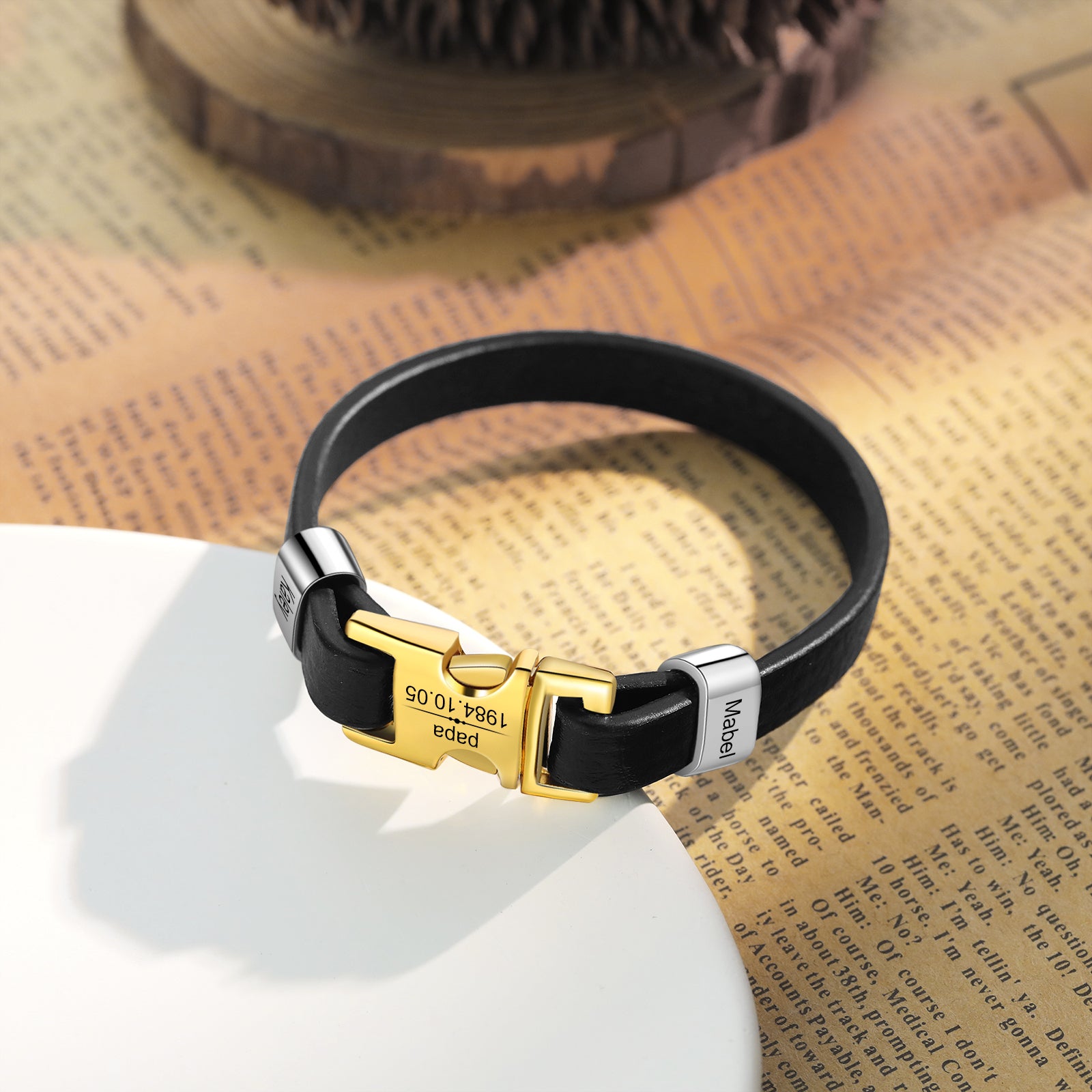 birthday stone bracelet, Personalized leather bracelet on white plate with gold buckle and text "Mabel"